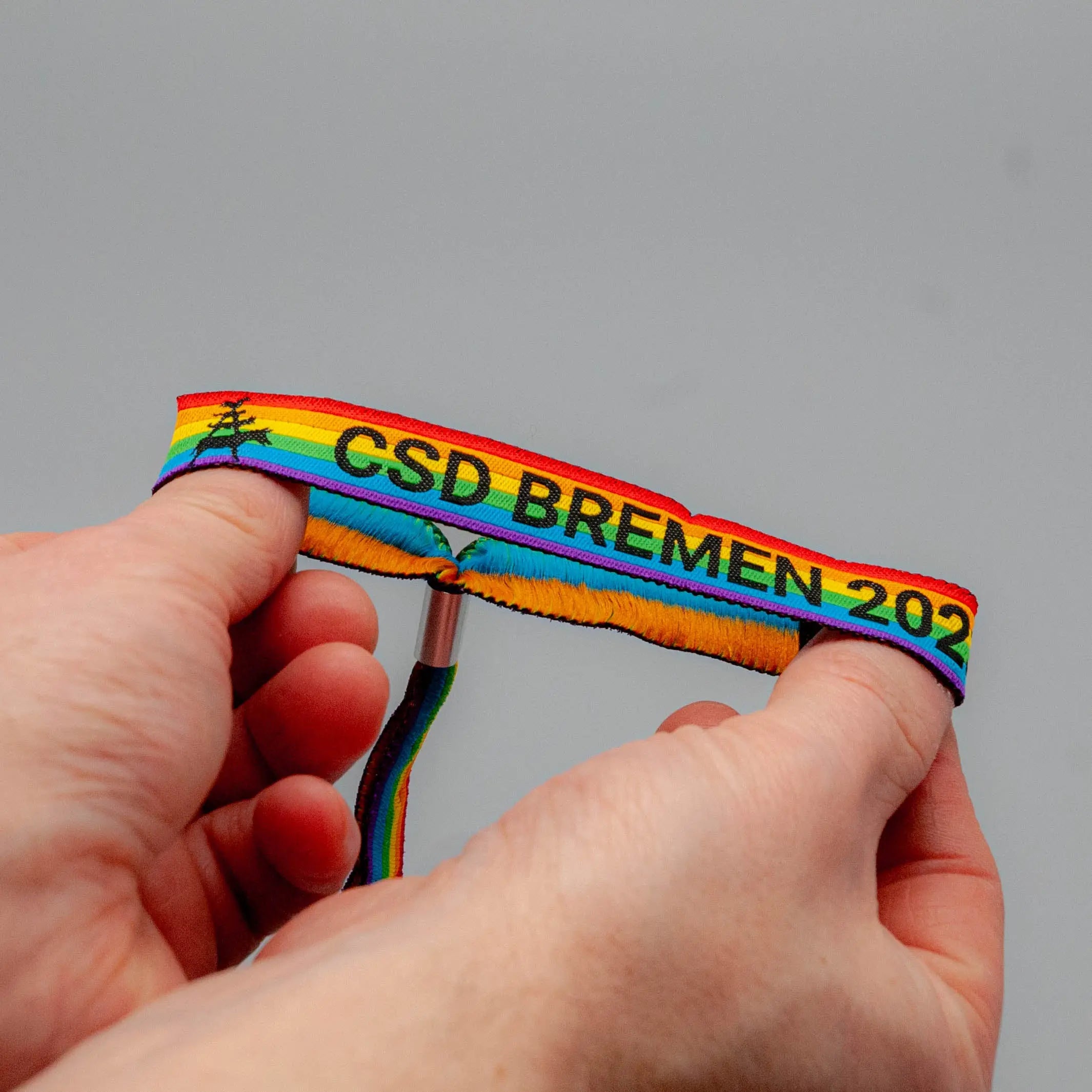 Pride-Armband des CSD Bremen 🌈 (Stoffarmband) - PrideMerch.de - Team Behinderte im Queer Cities e.V.