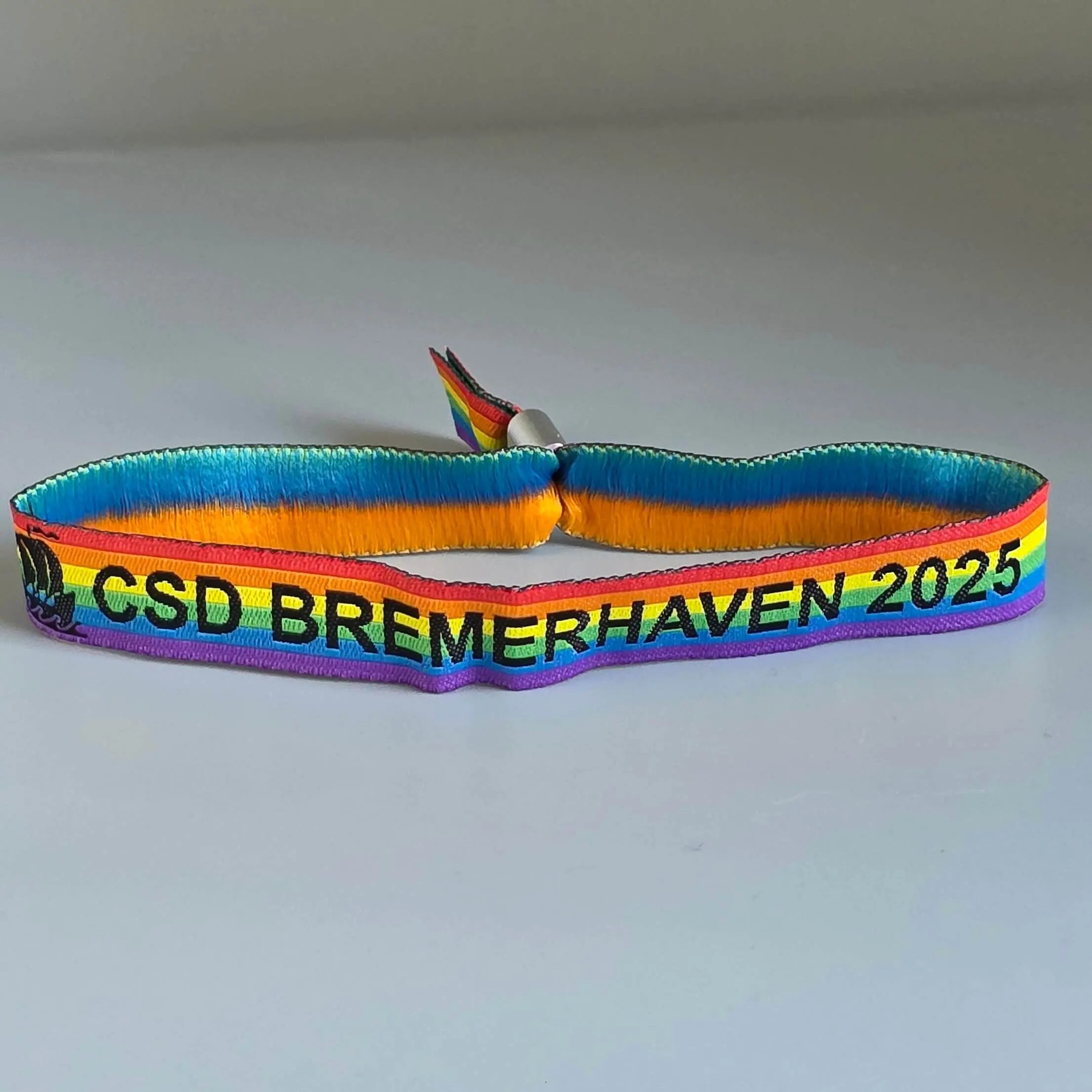 Pride-Armband des CSD Bremerhaven 🌈 (Stoffarmband) - PrideMerch.de - Team Behinderte im Queer Cities e.V.