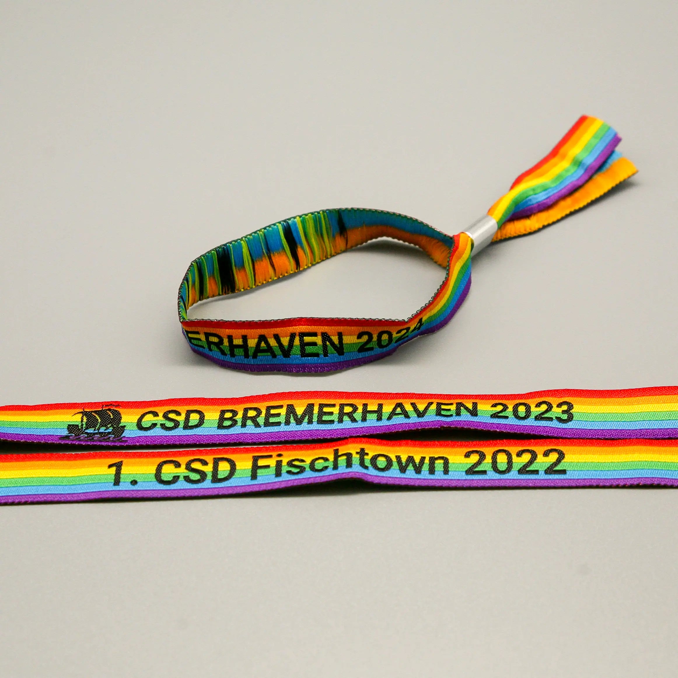 Pride-Armband des CSD Bremerhaven 🌈 (Stoffarmband) - PrideMerch.de - Team Behinderte im Queer Cities e.V.