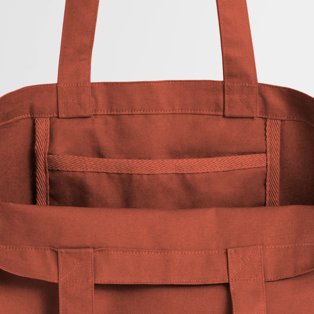 Das Innenleben der terrakotta-farbenen Tote Bag: Robuster Canvas-Stoff mit sicherem Steckfach