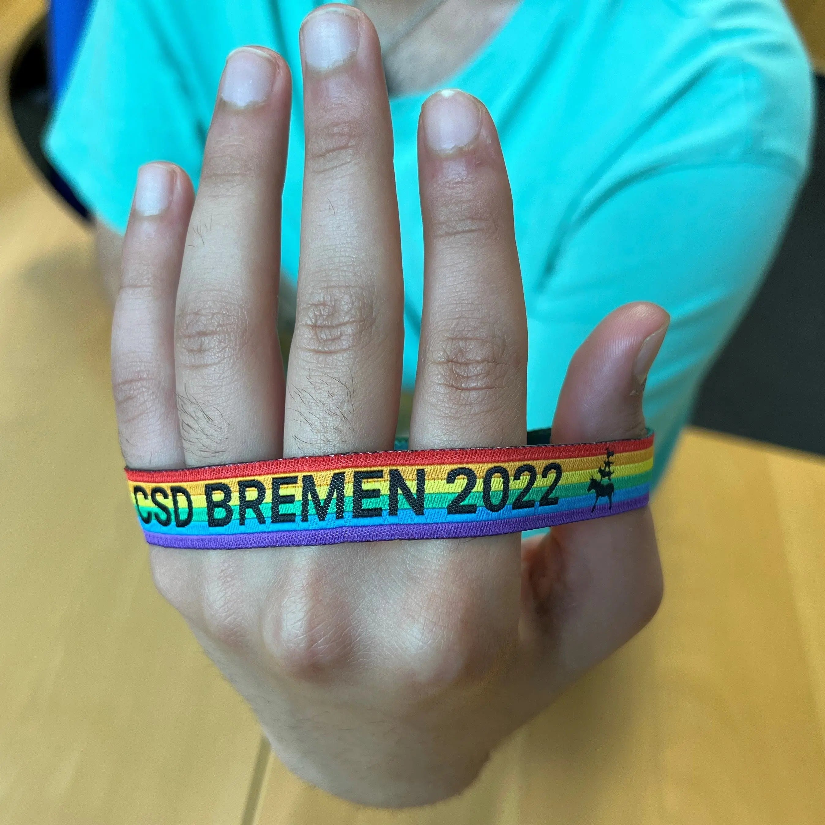 Pride-Armband des CSD Bremen 🌈 (Stoffarmband) - PrideMerch.de - Team Behinderte im Queer Cities e.V.