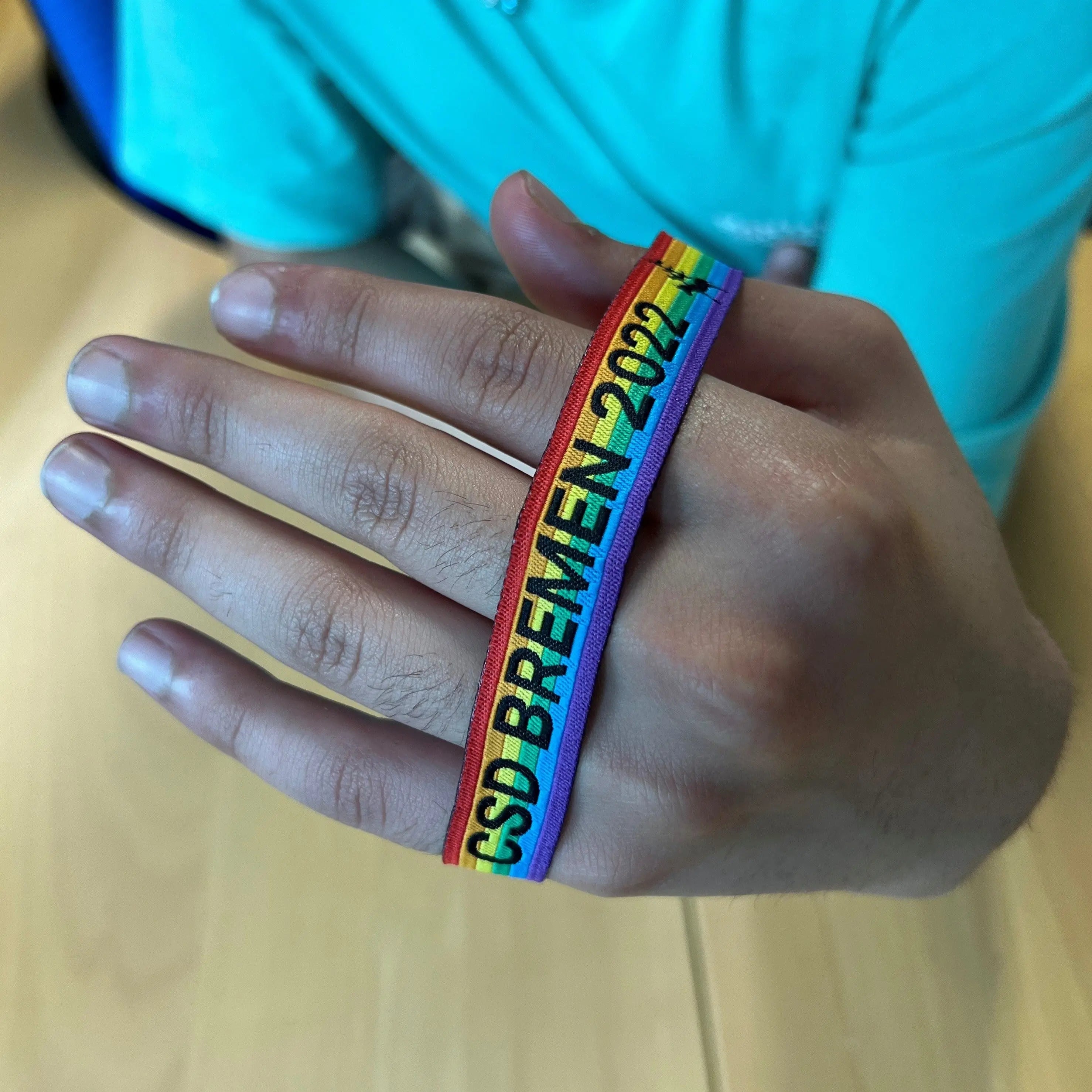 Pride-Armband des CSD Bremen 🌈 (Stoffarmband) - PrideMerch.de - Team Behinderte im Queer Cities e.V.